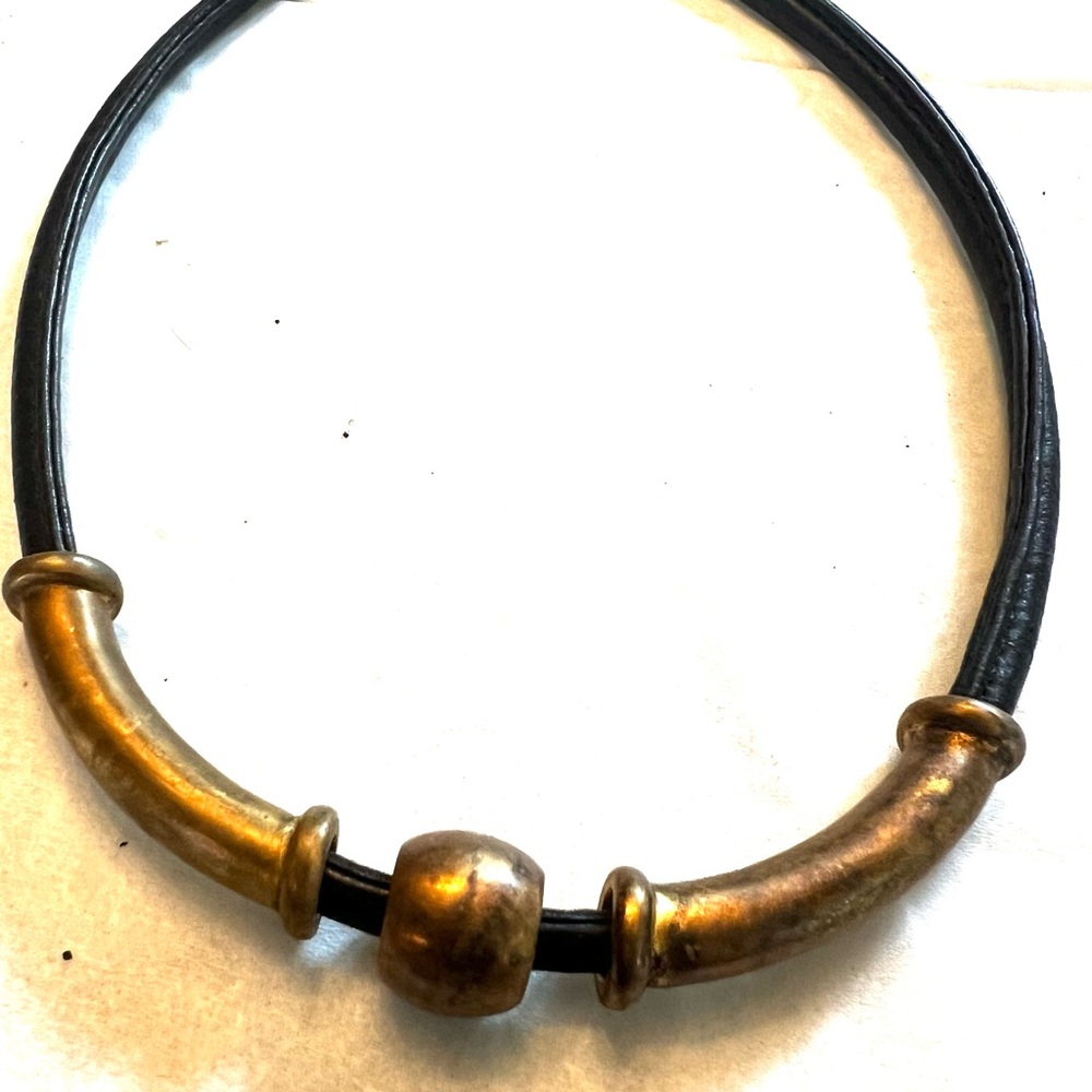 Black leather choker with distressed copper metals accent.